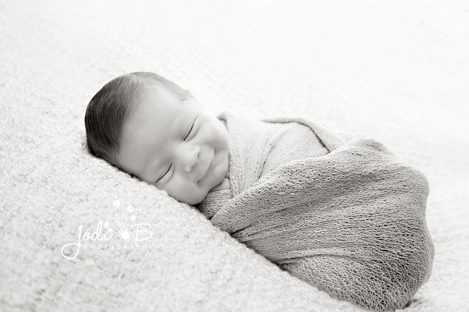 smiling newborn baby photographer